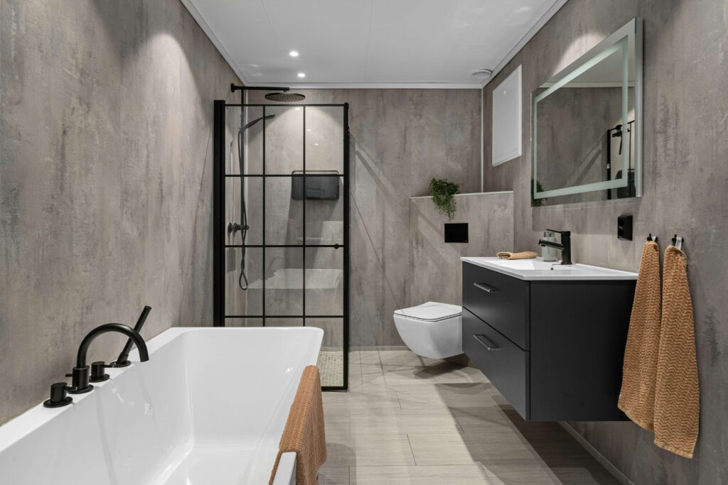 Bathroom with flat ceiling and semi-gloss trim providing moisture resistance and easy cleaning.